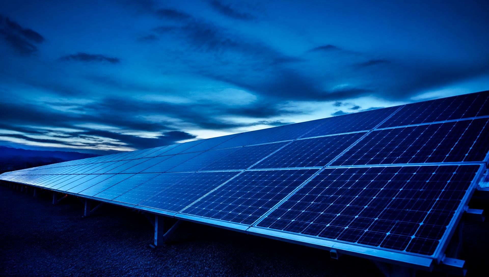 Solar array under a storm-lit sky